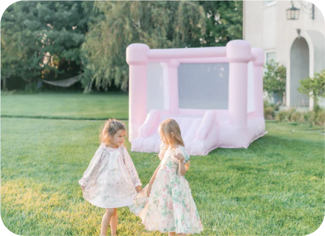 Drive By My Party beautiful white party rentals in Chicago girls playing bounce house
